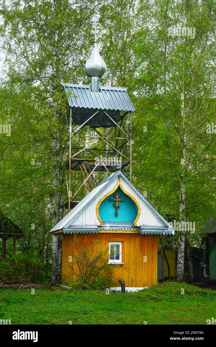 Bell tower of Orthodox Church of the Vladimir icon of the Mother of God in the village of Zelenogorsk, Kemerovo region Stock Photo