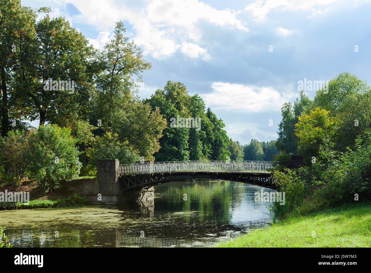 Walking across bridge greenery hi-res stock photography and images - Alamy