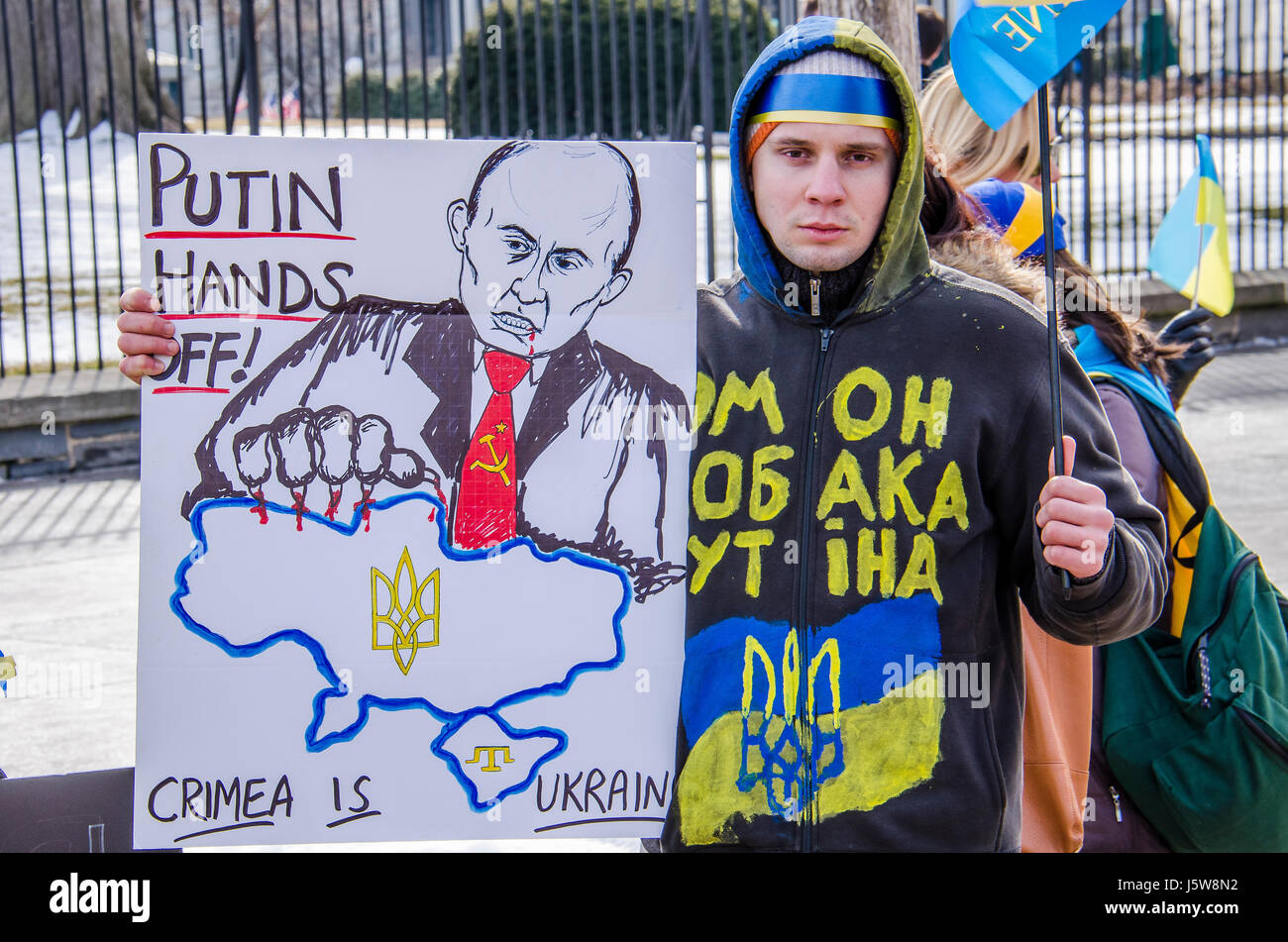 Washington DC, USA - March 6, 2014: Closeup of man with sign about Russia and Putin during Ukrainian protest by White House Stock Photo
