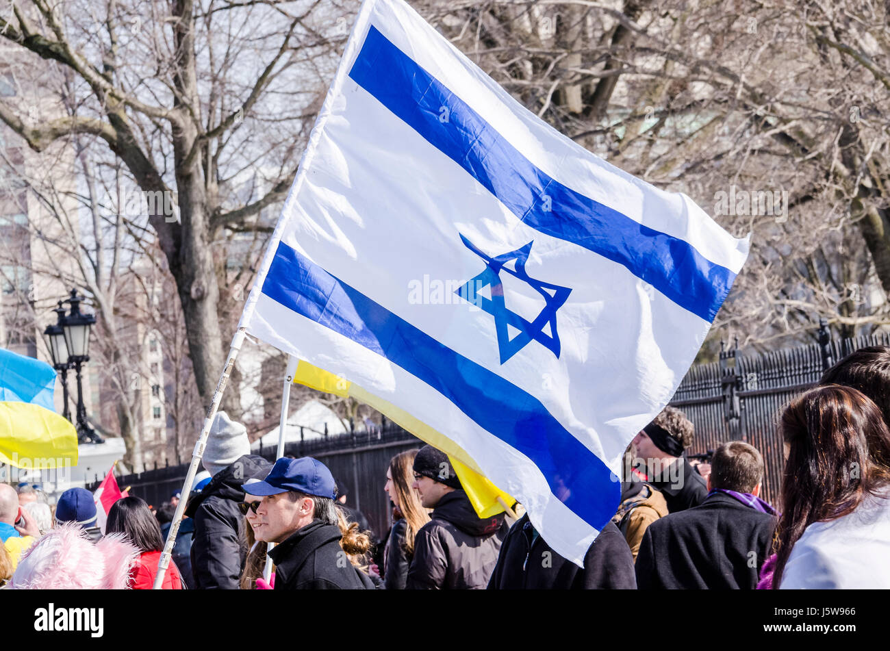 Washington DC, USA - March 6, 2014: People holding flag of Israel during Ukrainian protest by White House Stock Photo