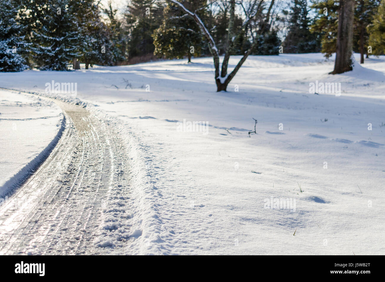 Curvy road covered in winter snow in Virginia Stock Photo Alamy