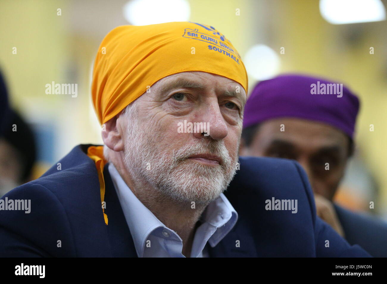 Labour leader Jeremy Corbyn joins worshippers at the Sri Guru Singh Sabha in Southall, London, during a general election campaign visit. Stock Photo