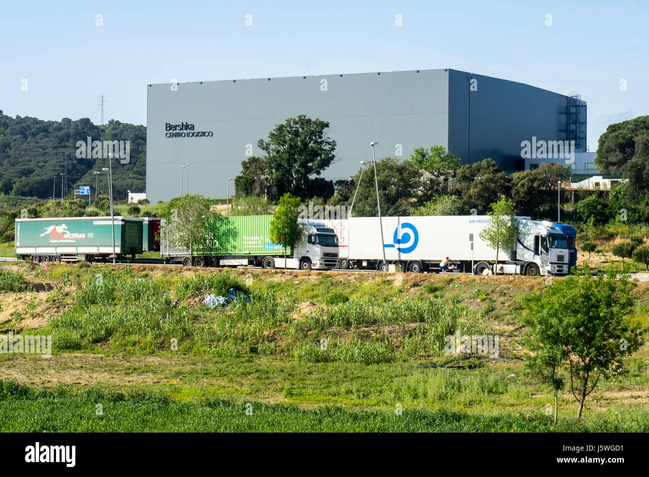 Semi trailers parked outside the central logistics warehouse for the retail  company Bershka in Catalonia, Spain Stock Photo - Alamy