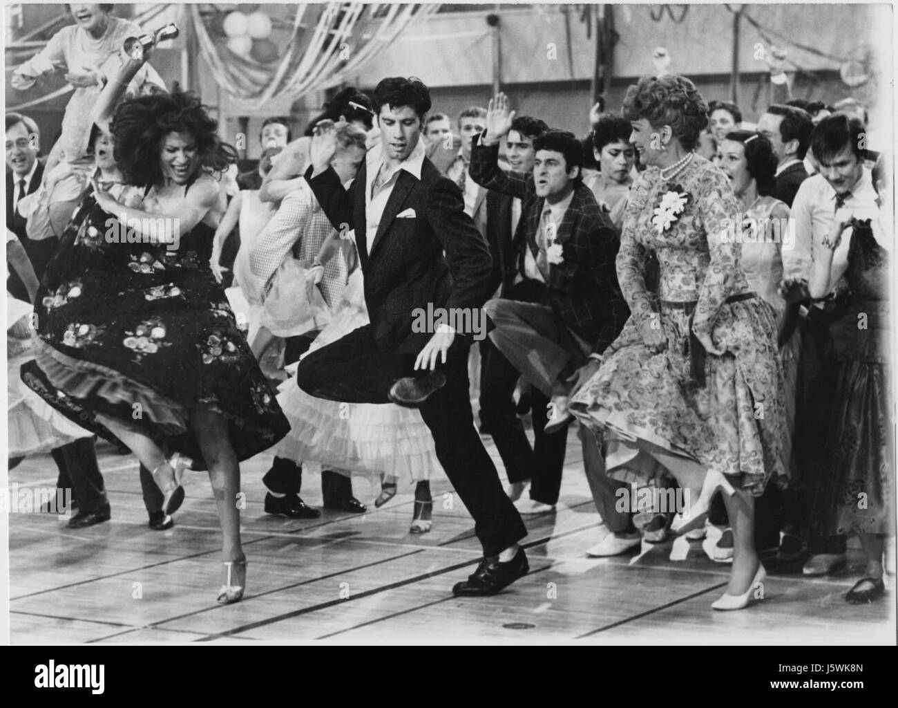 John Travolta, Eve Arden and Cast on-set of the Film, 'Grease', 1978 Stock Photo