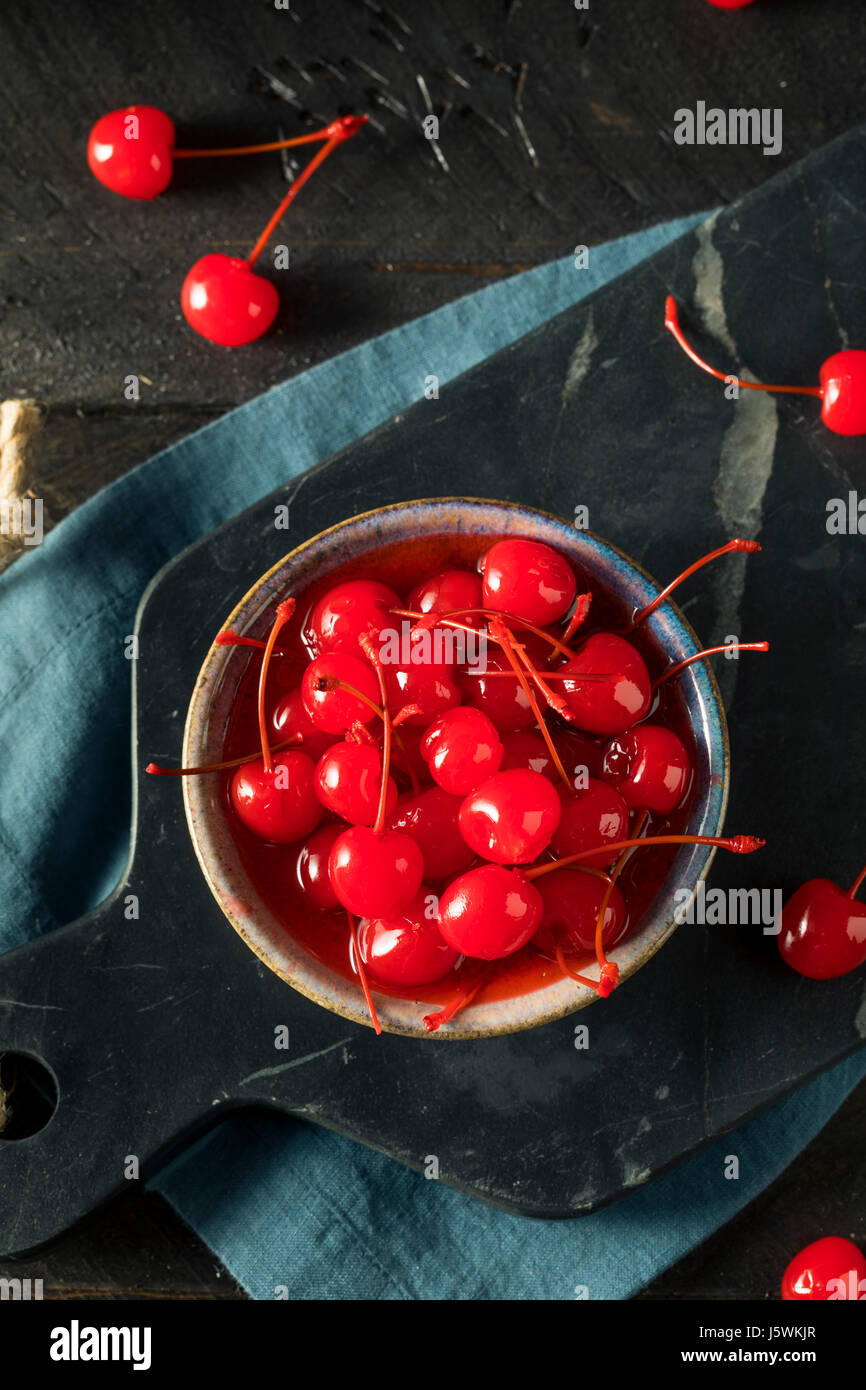 Sweet Red Maraschino Cherries in Sticky Syrup Stock Photo