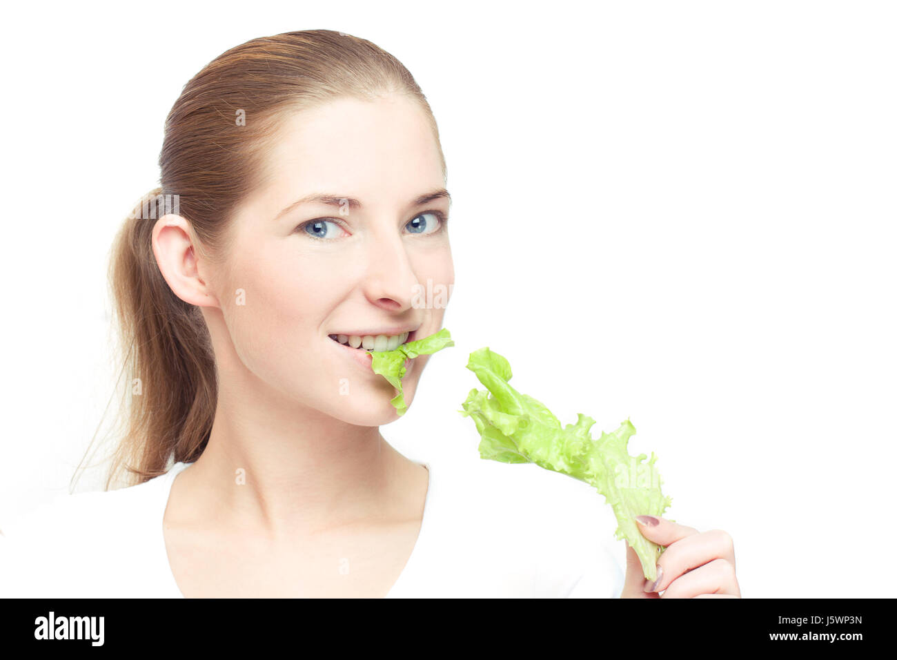 woman leaf diet lettuce young younger white dapper accosting pretty prettily Stock Photo