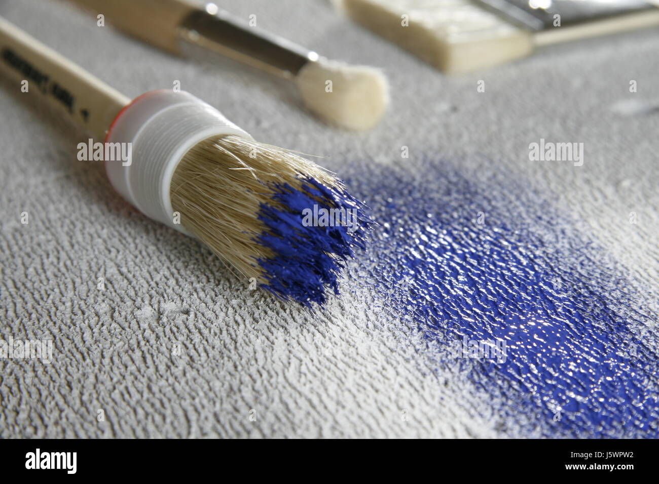 blue colour hobby paint paintbrush brush wall blue colour hobby paint Stock Photo