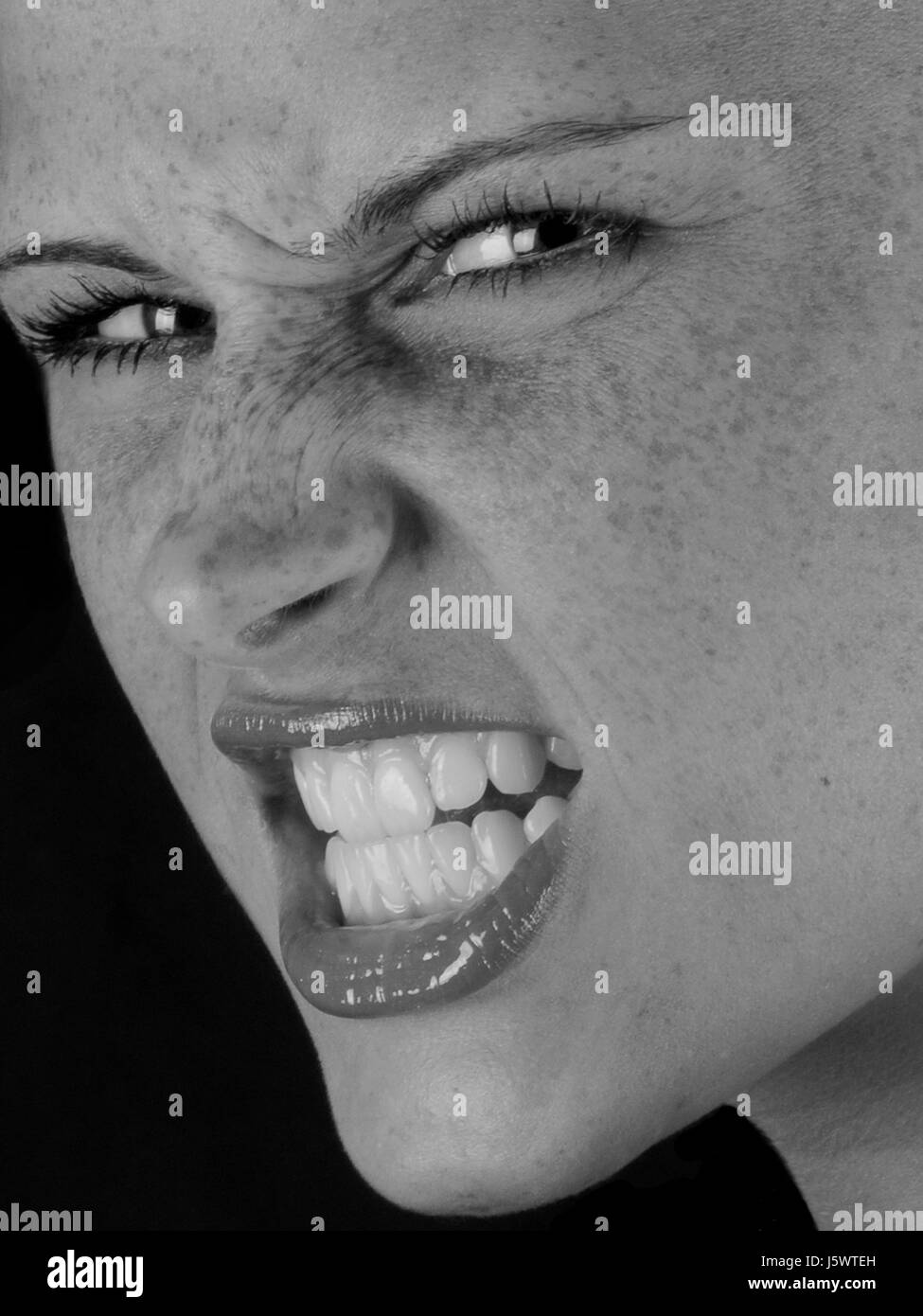 woman teeth bad peccant wickedly evil sour freckles raving furious angry Stock Photo