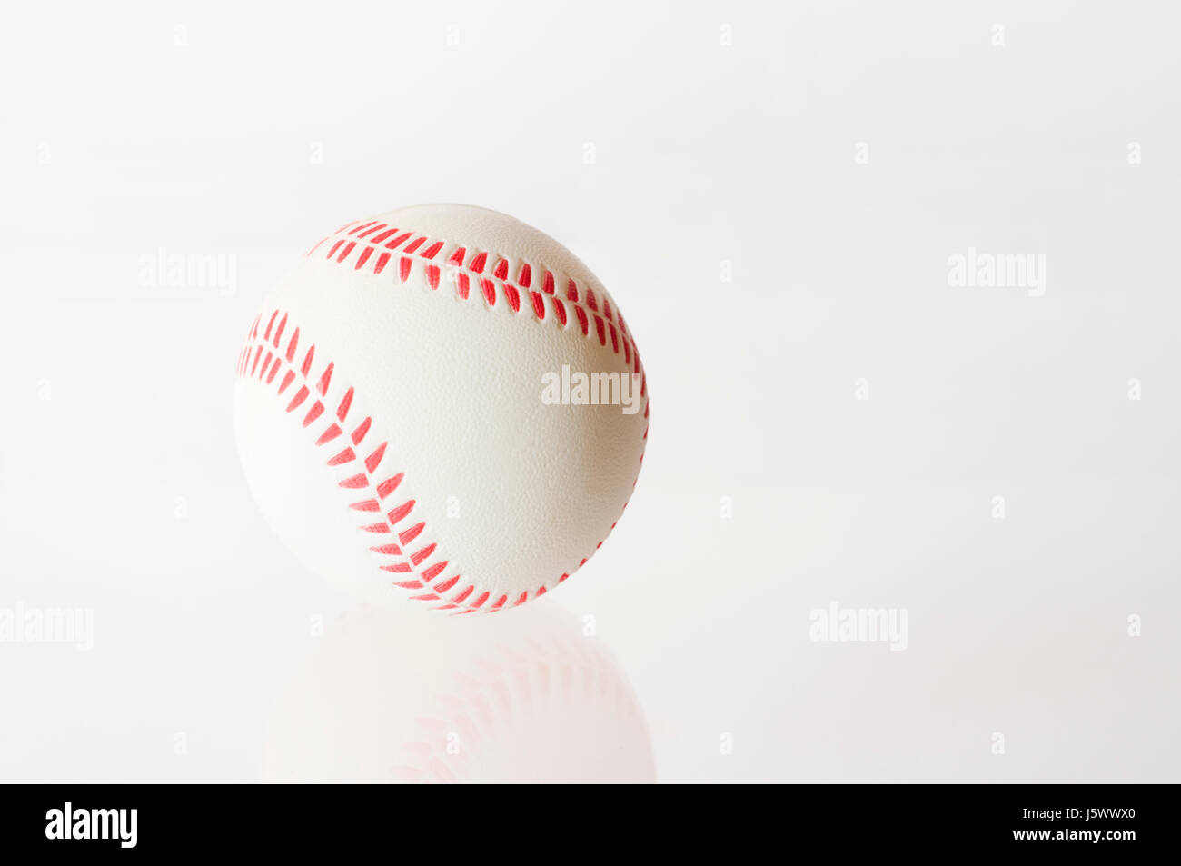 ball sport-turned out baseball pale bright pure white snow white sport sports Stock Photo