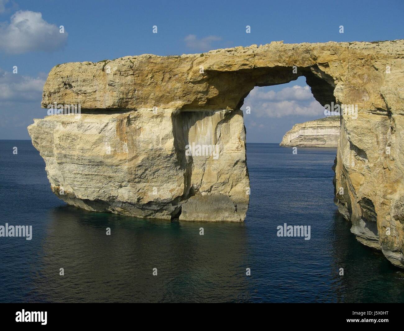 stone window porthole dormer window pane rock malta salt water sea