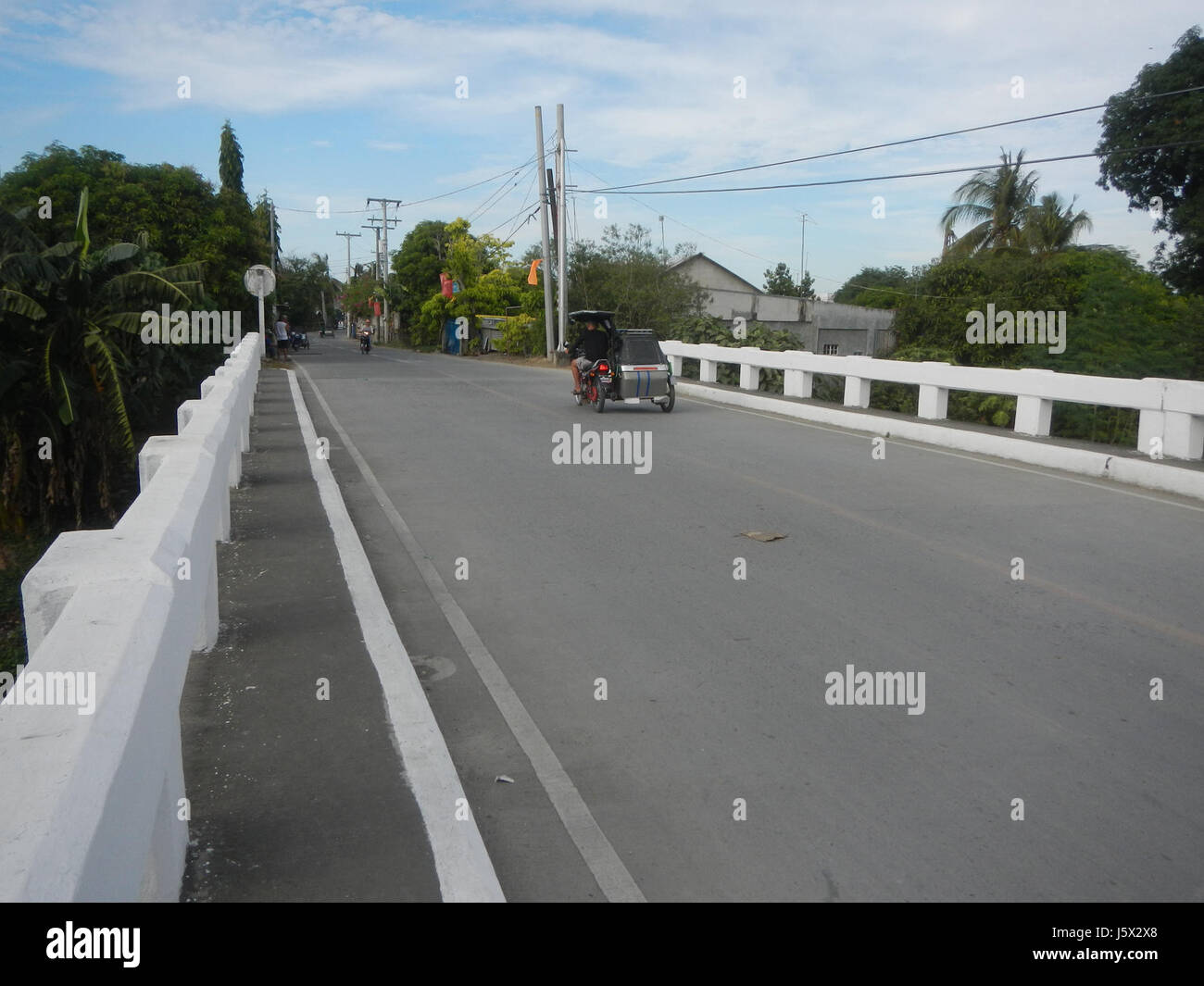 Sumacab This image captures the road leading to Sumacab Bridge in the Poblacion ...