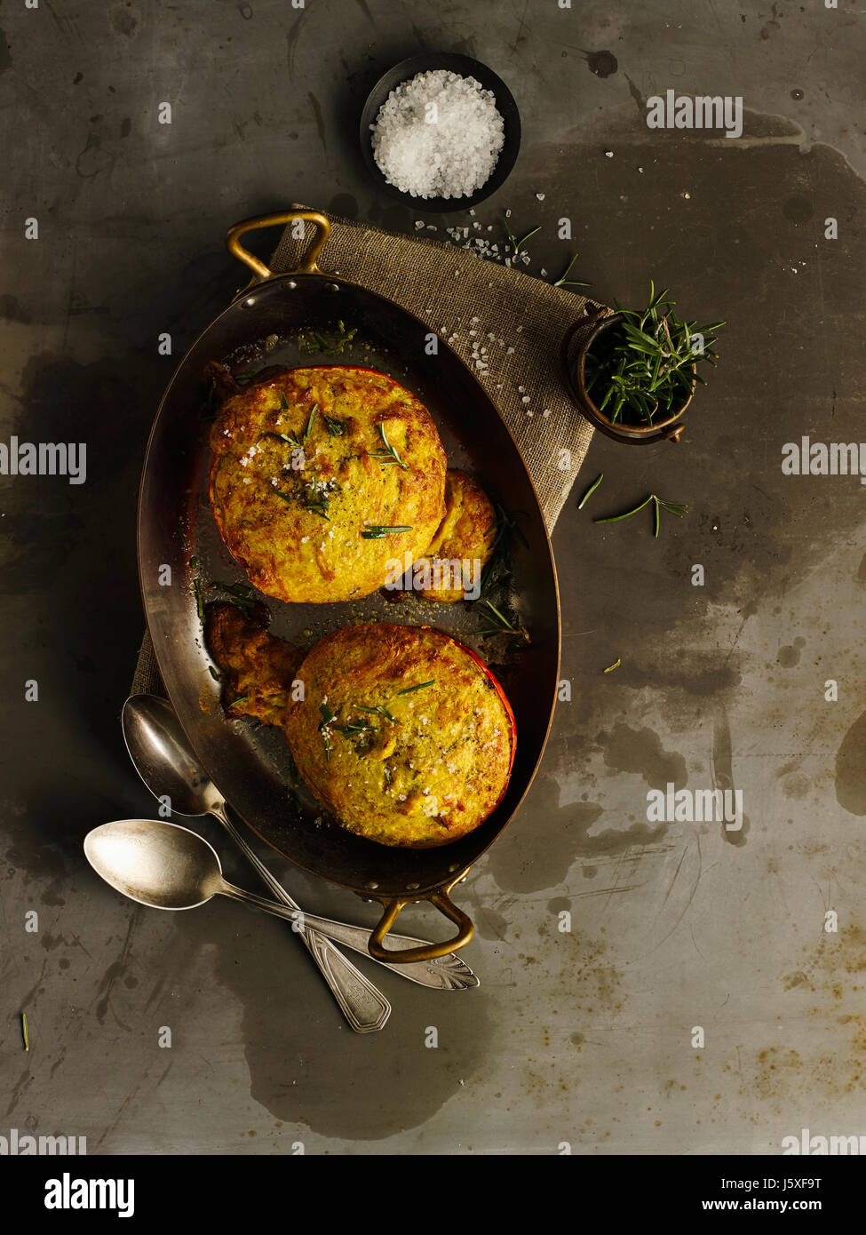 Filled pumpkin with parmesan and herbs Stock Photo