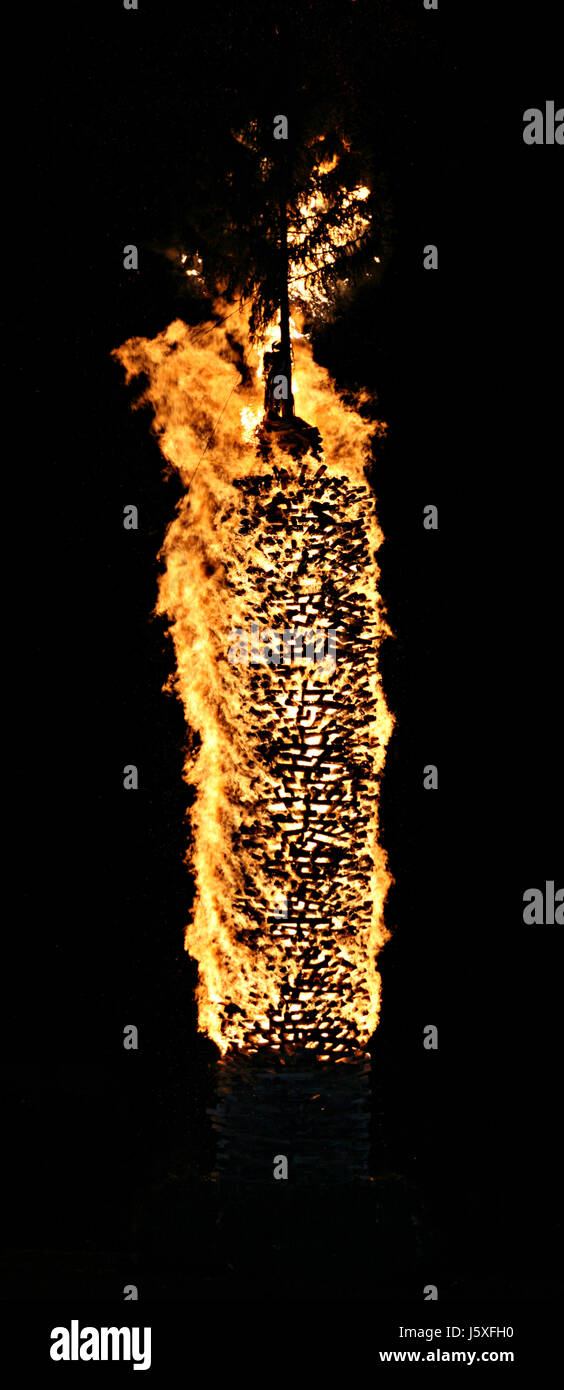 wood fire conflagration custom flame to burn down traditions burn sparks winter Stock Photo