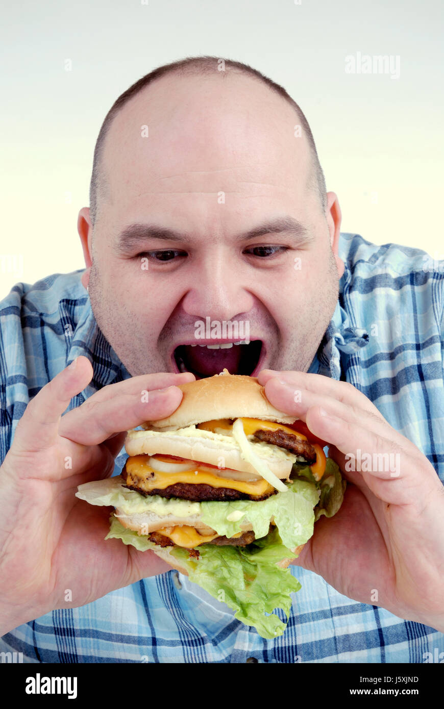 man with cheeseburger Stock Photo Alamy