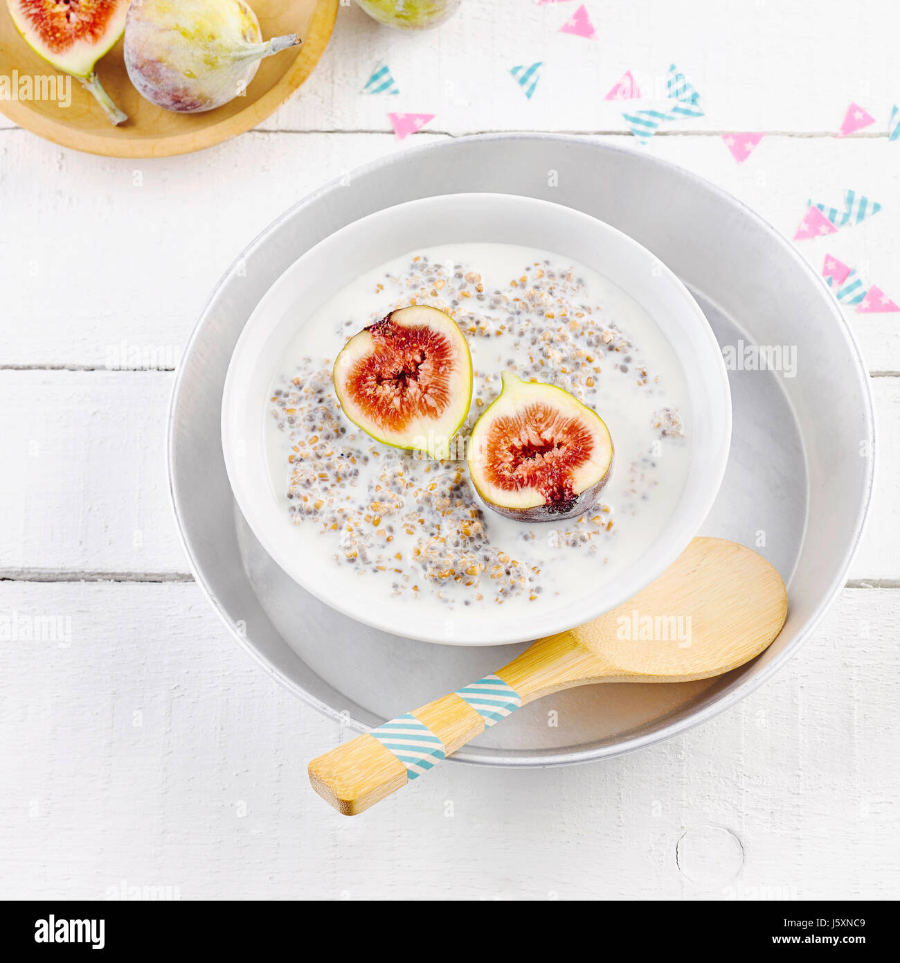 Spelt porridge with chia seeds and figs Stock Photo Alamy