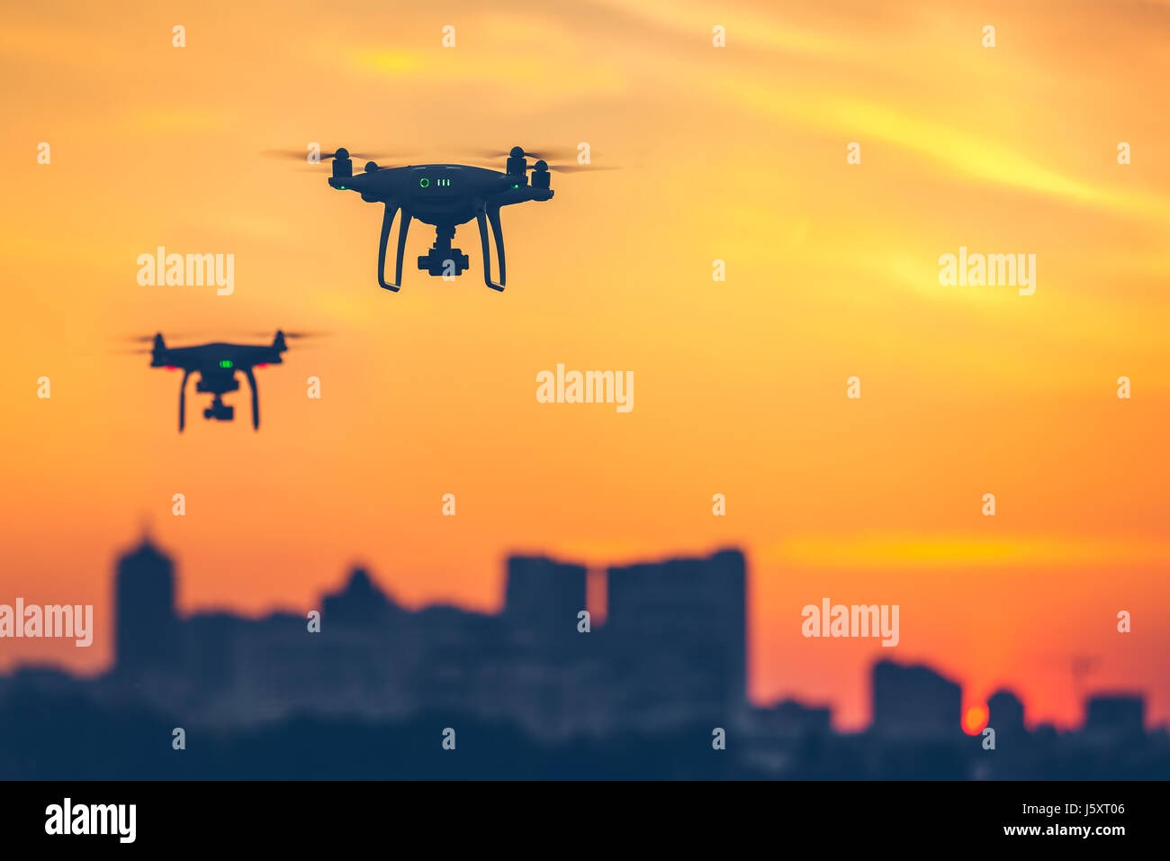 Two modern Remote Control Air Drones Fly with action cameras Stock