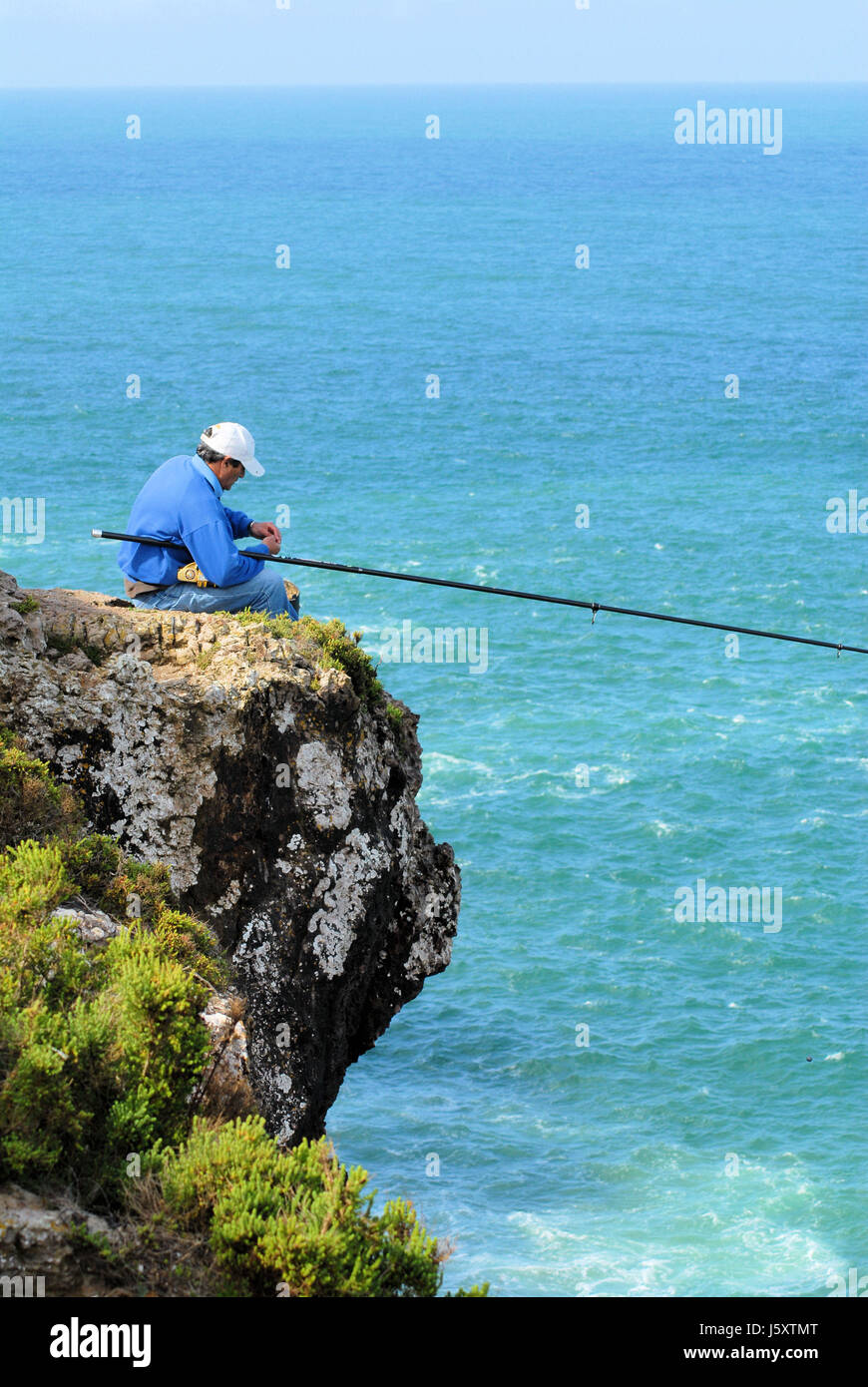 rock fishing rod salt water sea ocean water angler fish rock