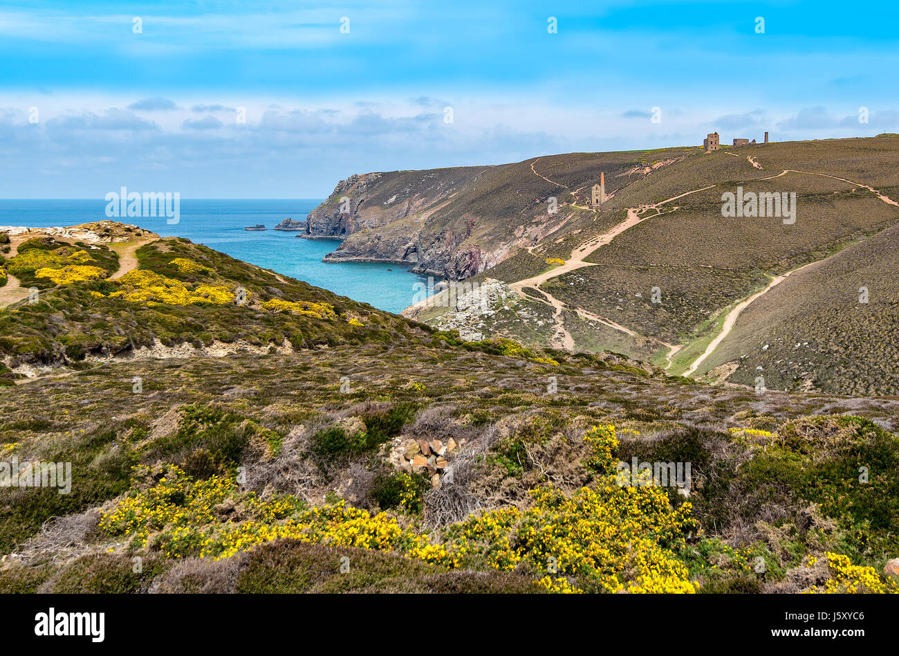 Coastal scene near Chapel Porth, Cornwall with the Wheal Coates mine buildings in the distance. Stock Photo
