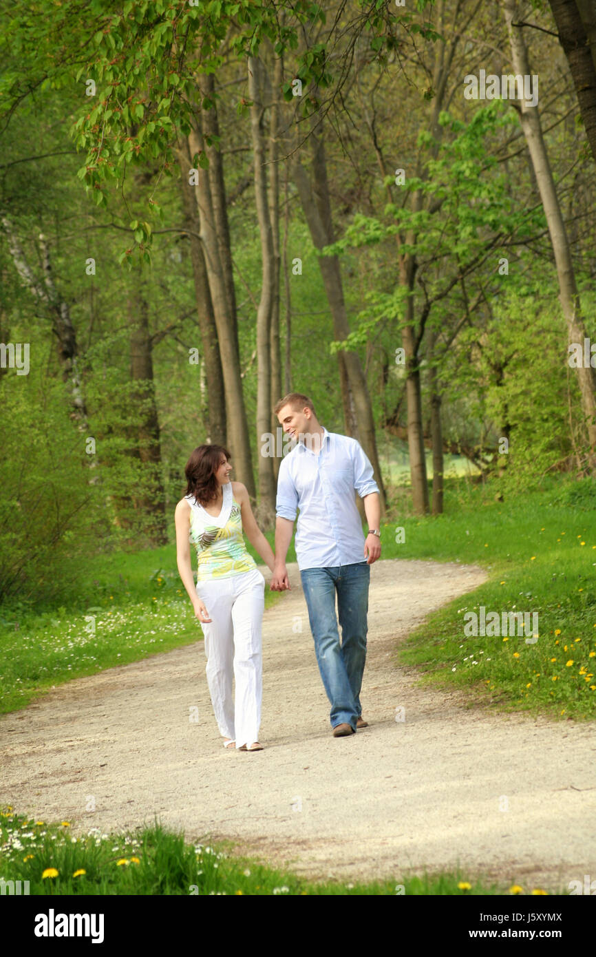 happy couple in the park while walking Stock Photo - Alamy