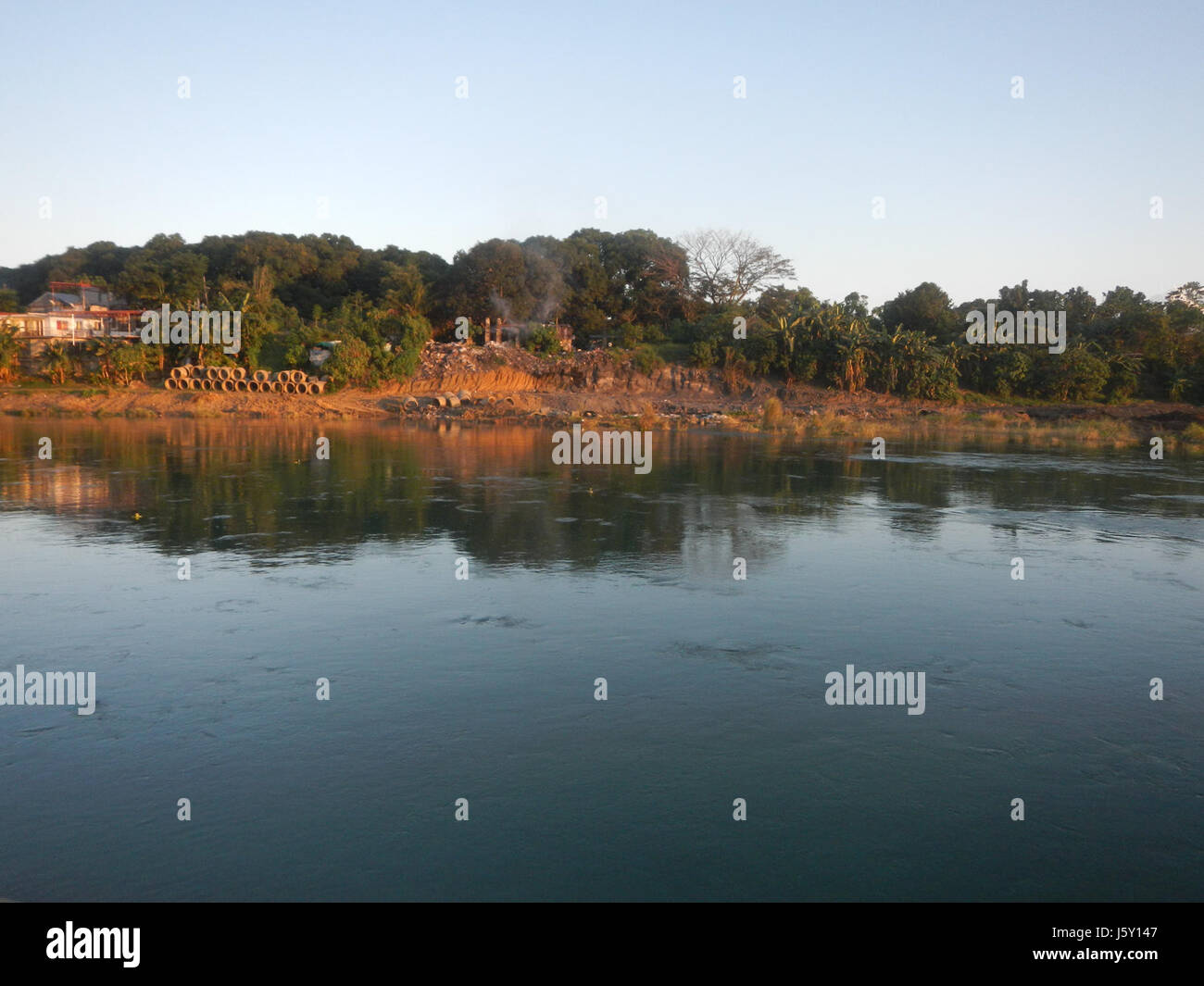 This image depicts the construction of slope protection along the Angat ...