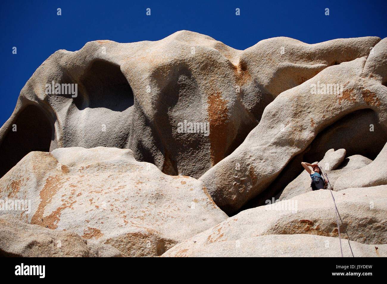 woman blue holiday vacation holidays vacations rock rise climb climbing ascend Stock Photo