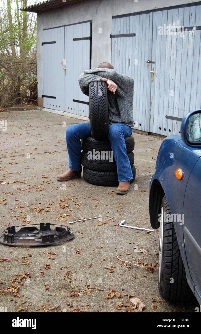 car automobile vehicle means of travel motor vehicle despair snow tyre change Stock Photo