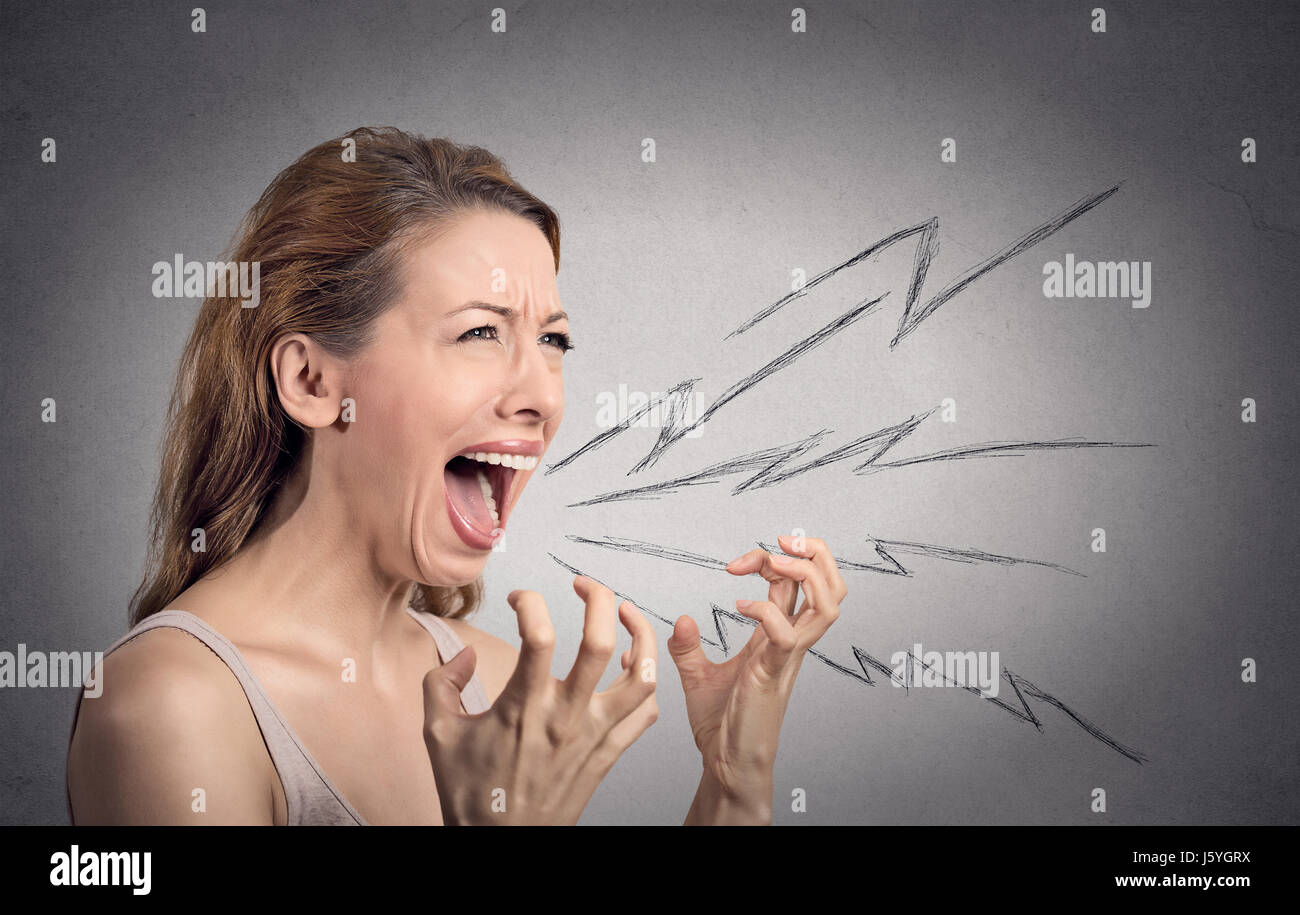 Side view portrait angry woman screaming, wide open mouth, hysterical