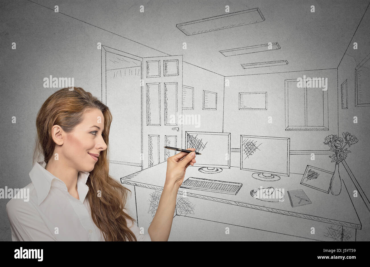 Portrait woman designer drawing with pen, pencil future apartment, architecture, home renovation, remodeling concept isolated on grey wall background. Stock Photo