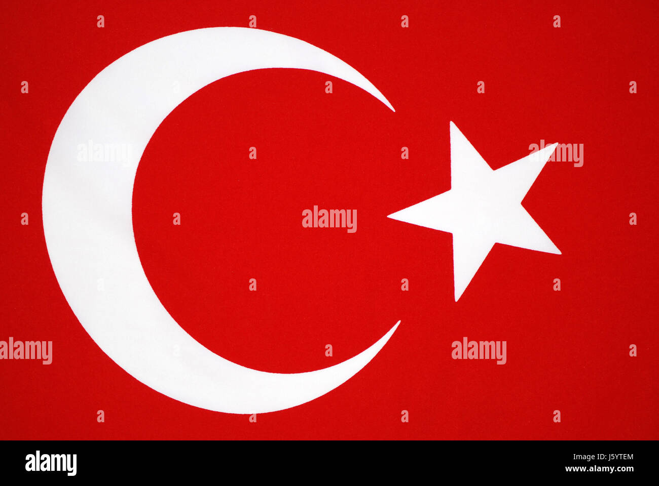 Red flag with white sale moon and star
