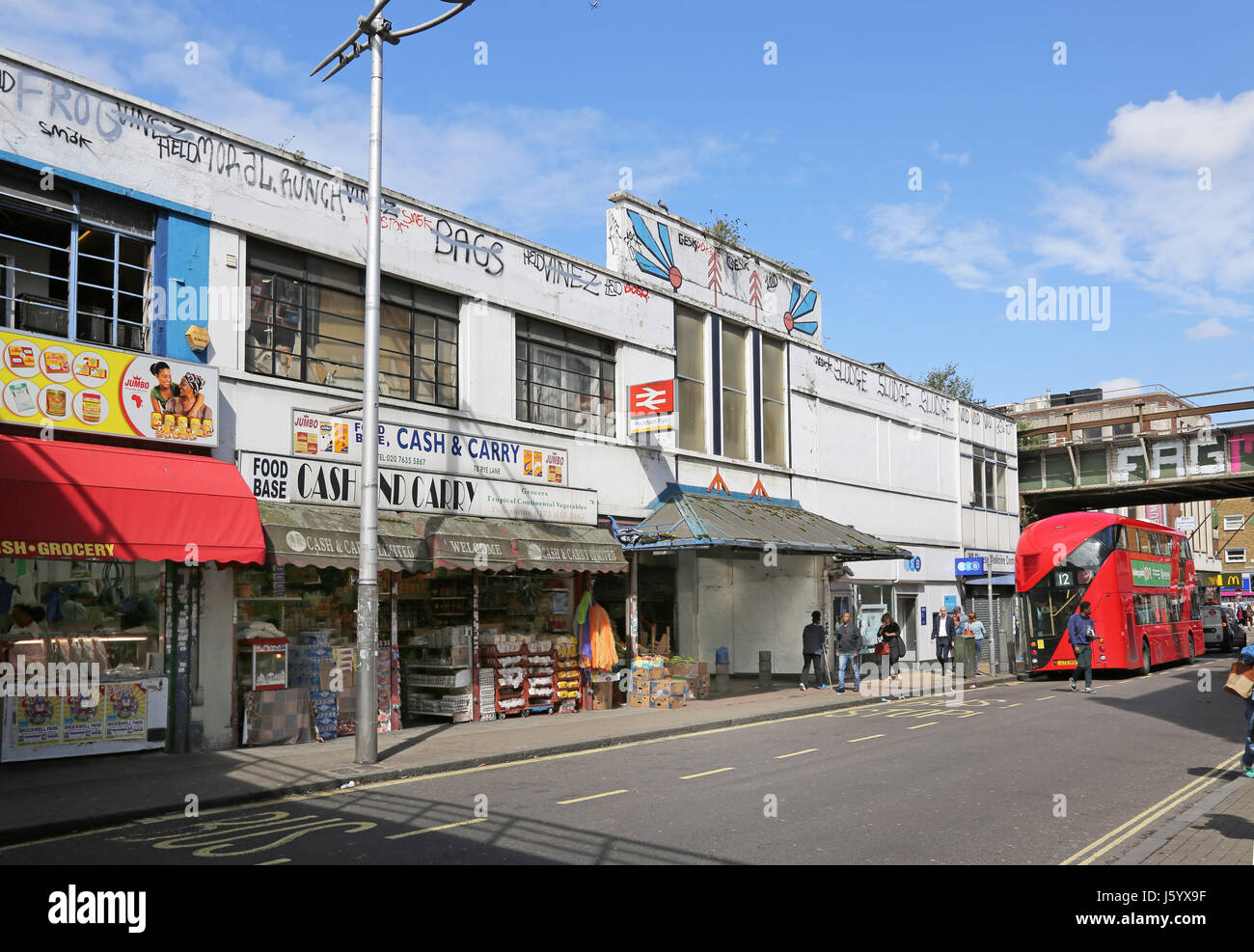 Entrance to Peckham Rye Station on Rye Lane in southeast London. Shows the run-down 1950s shopping arcade scheduled for demolition in new plans. Stock Photo
