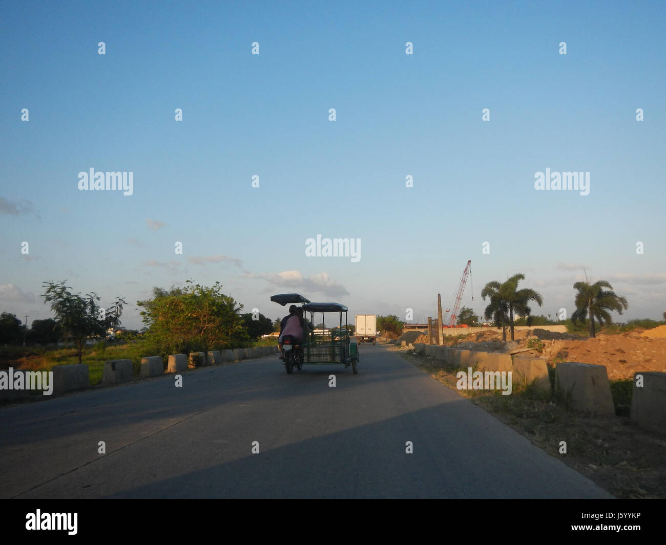 This image shows the Diversion Road, crossing through rice paddies near ...
