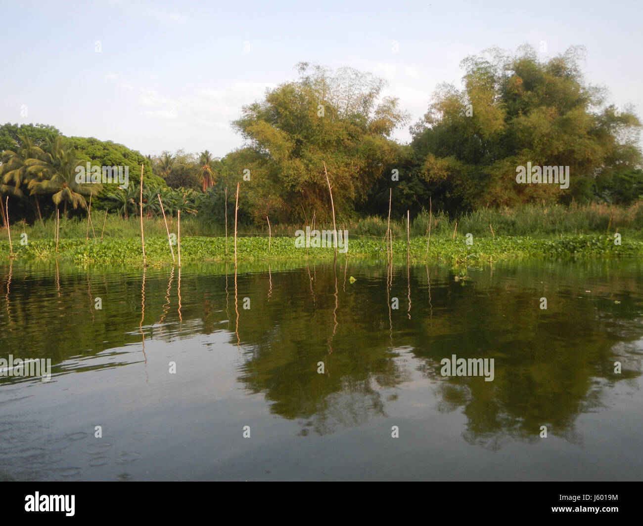 This image shows the construction of riprap along the riverbanks in ...