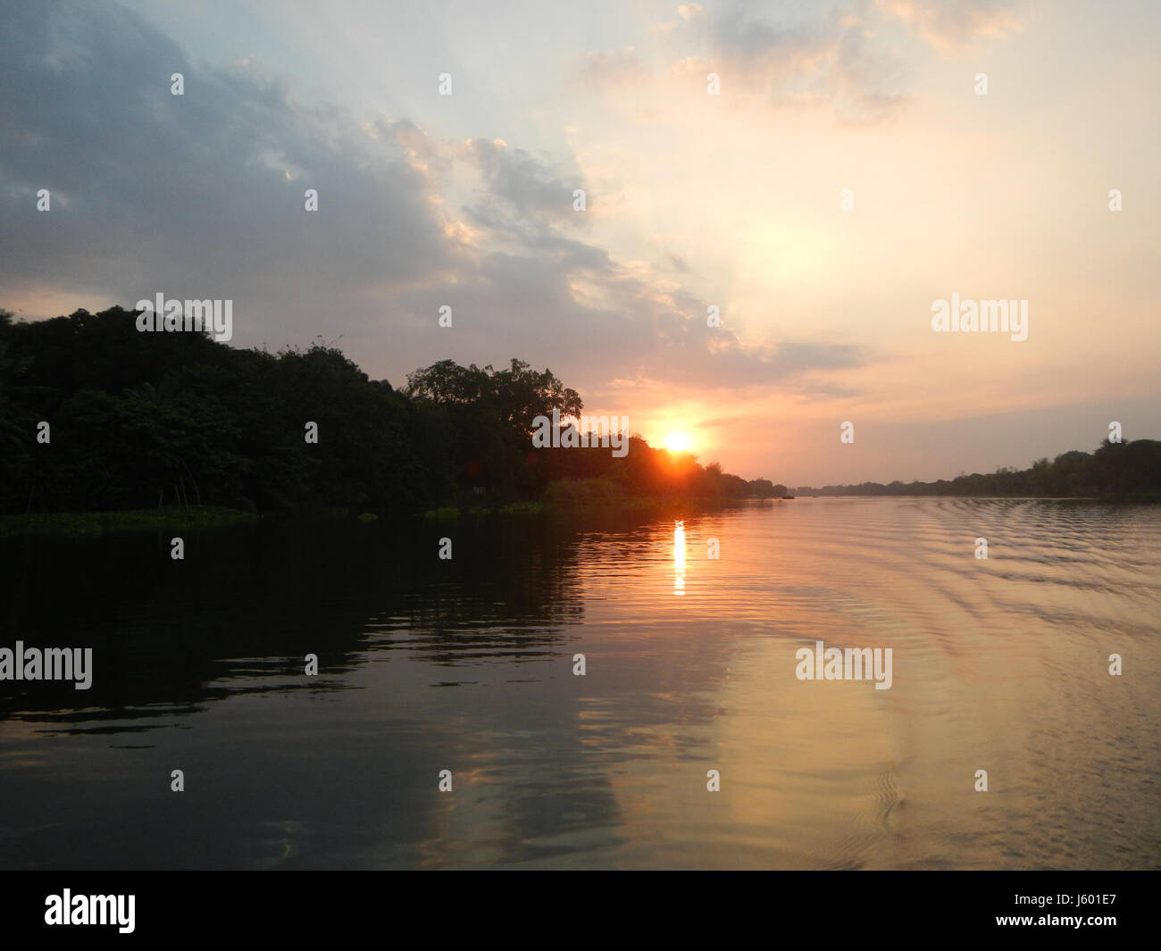 This image captures a scenic sunset over the riverside districts of ...