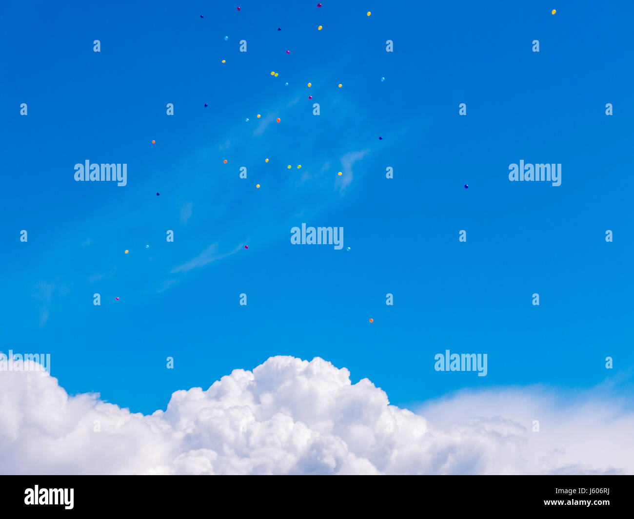 Colorful balloons flying up in the bright blue sky Stock Photo - Alamy