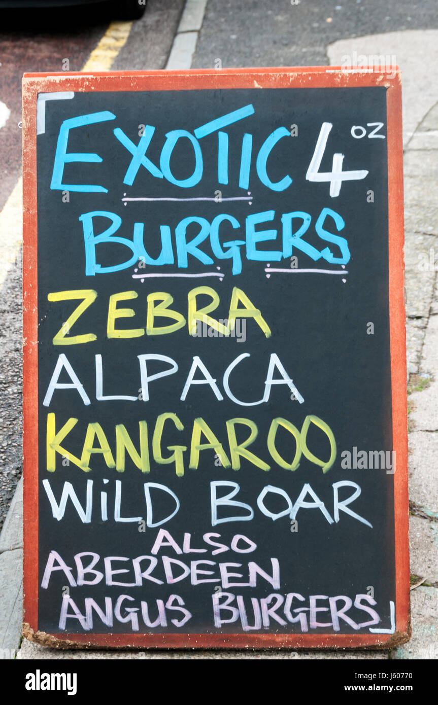 Sign for exotic meat burgers outside a butchers. Stock Photo