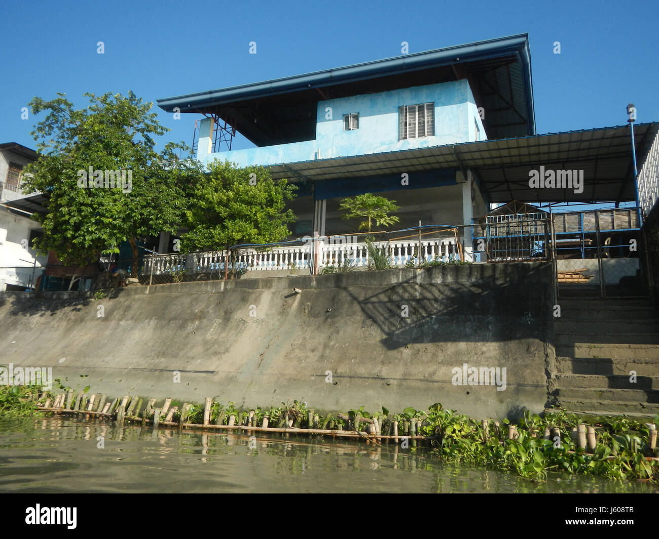 This image shows the riprap constructions along the riverbanks of the ...
