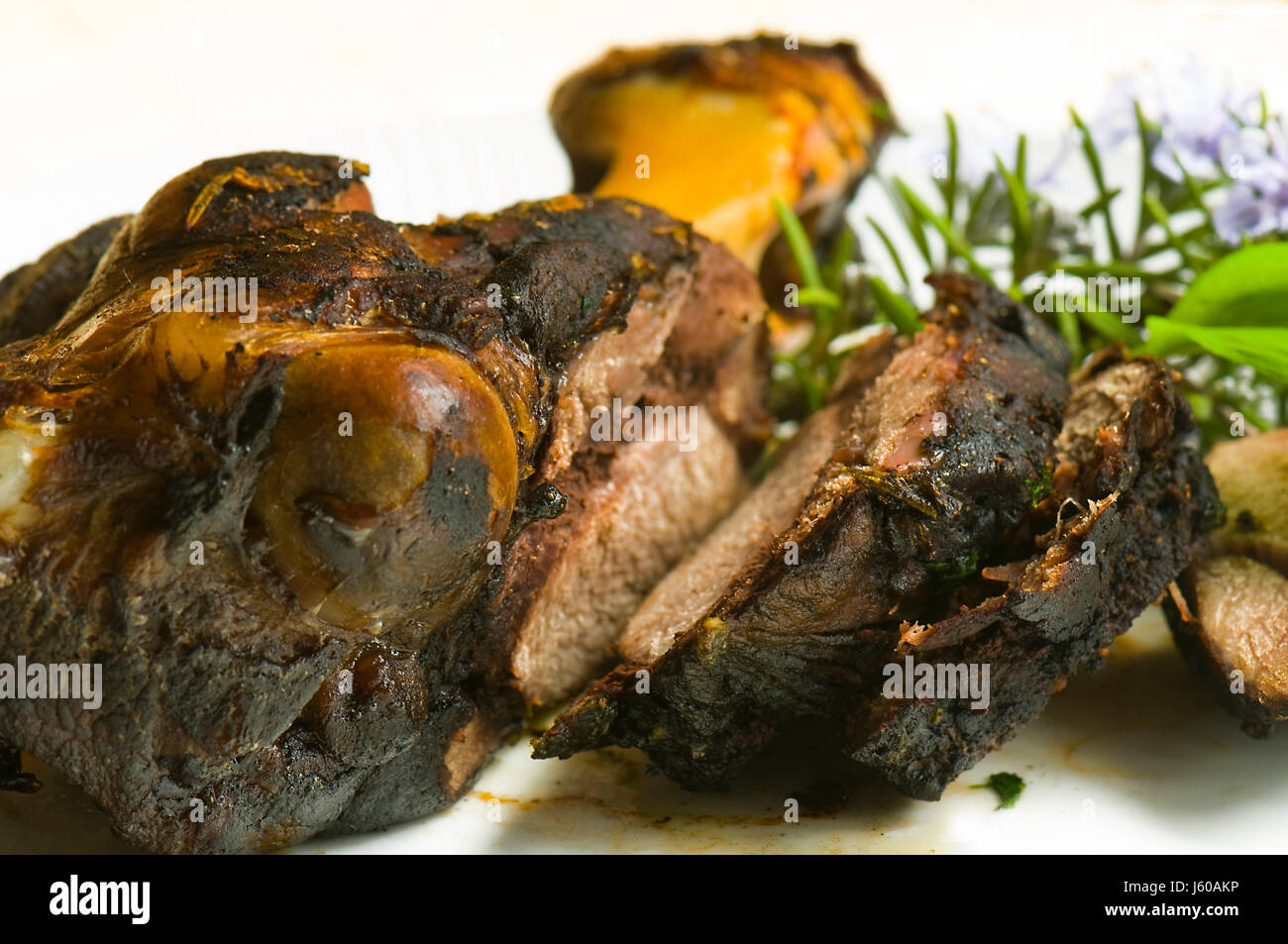 wild wild boar pig shoulder hand wild shoulder young of a wild boar rosemary Stock Photo