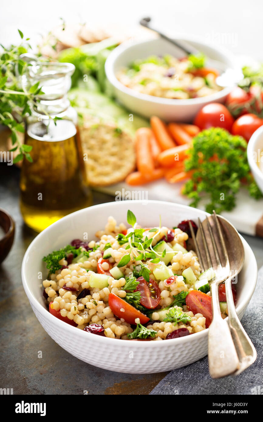 Pearl couscous salad with fresh vegetables Stock Photo