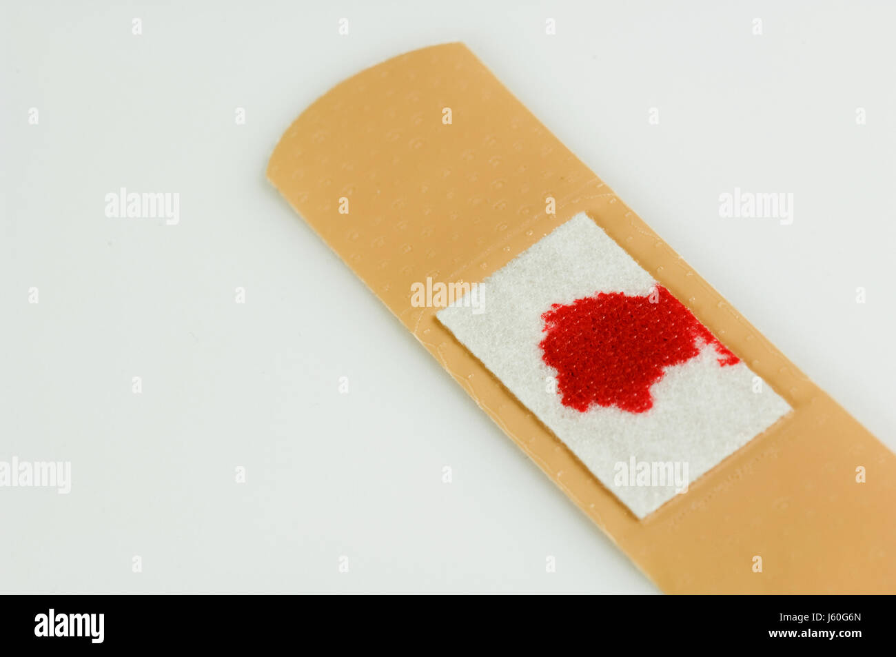 plaster blood bloody bloodstain blossoms plaster wound hurt injury blood bleed Stock Photo