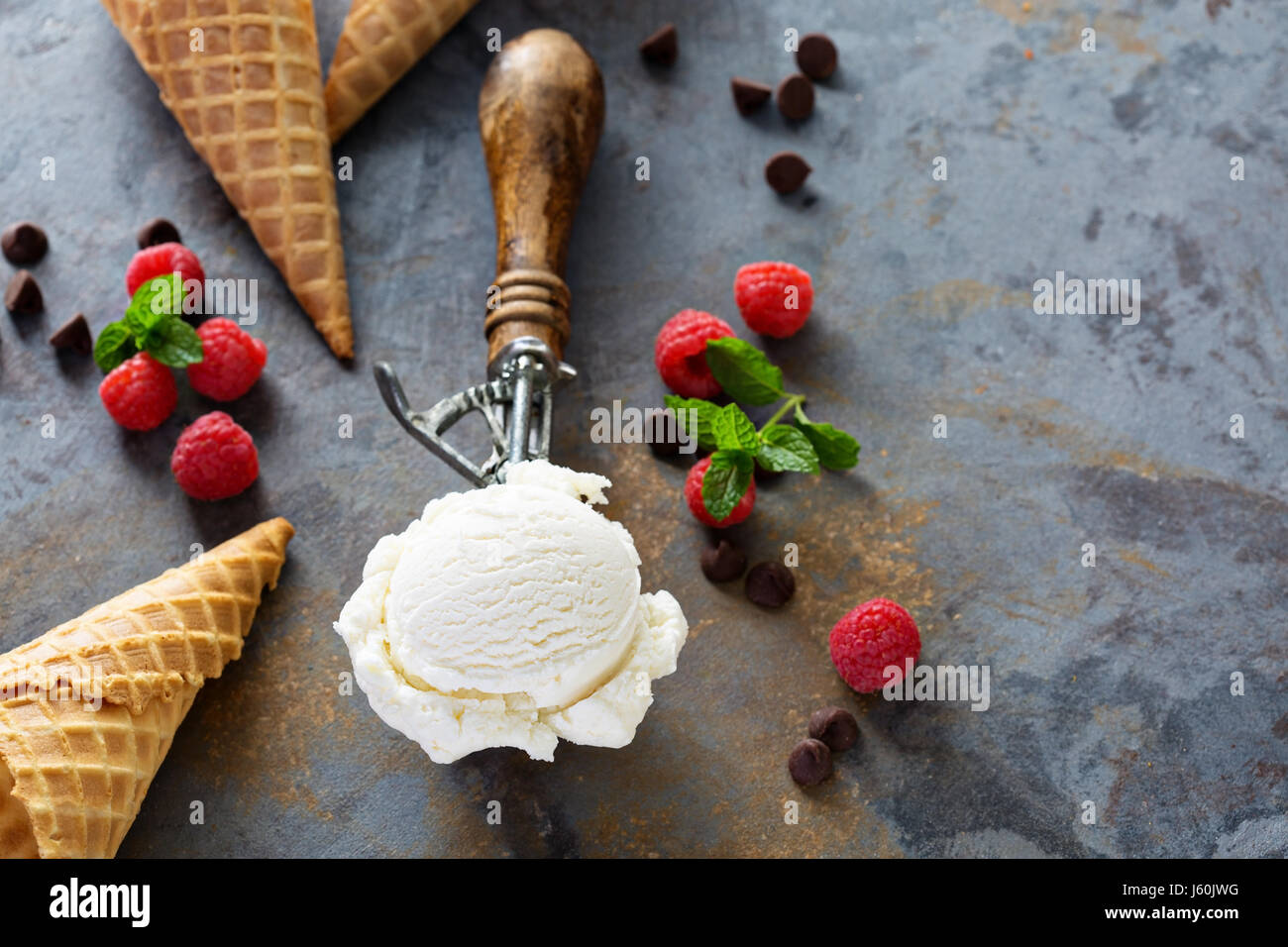 Vanilla ice cream scoop in a spoon Stock Photo Alamy