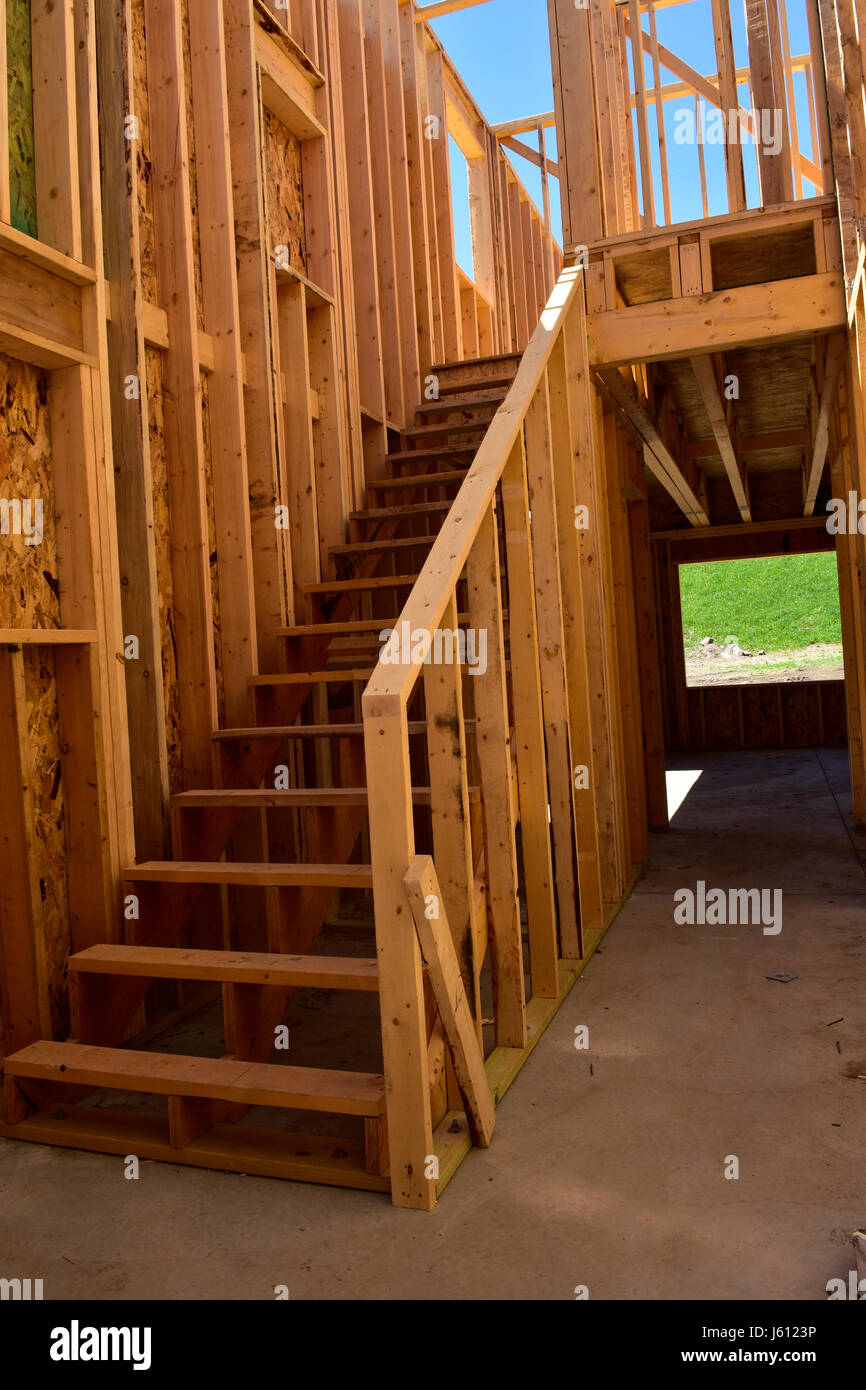 Wood frame residential buildings under construction. Stock Photo