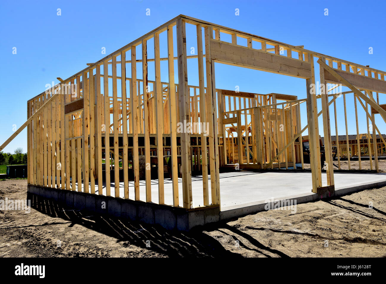 Wood frame residential buildings under construction. Stock Photo
