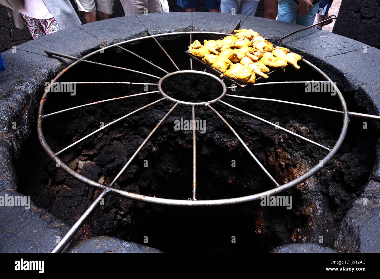 El Diablo Restaurant cooking food using heat from the ground in the volcanic active area of Timanfaya National Park, Lanzarote, Canary Islands, Spain Stock Photo