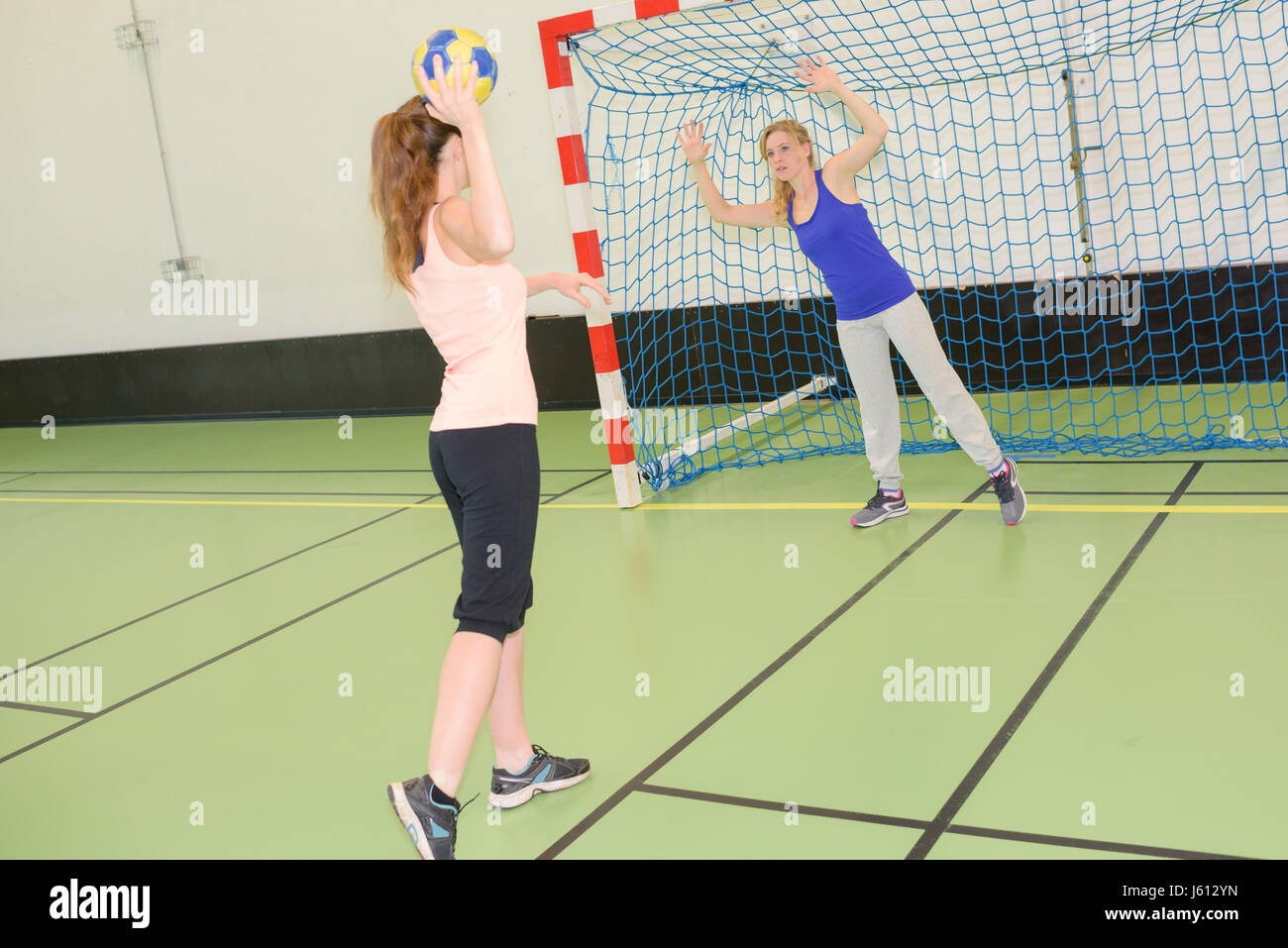 Women playing handball Stock Photo