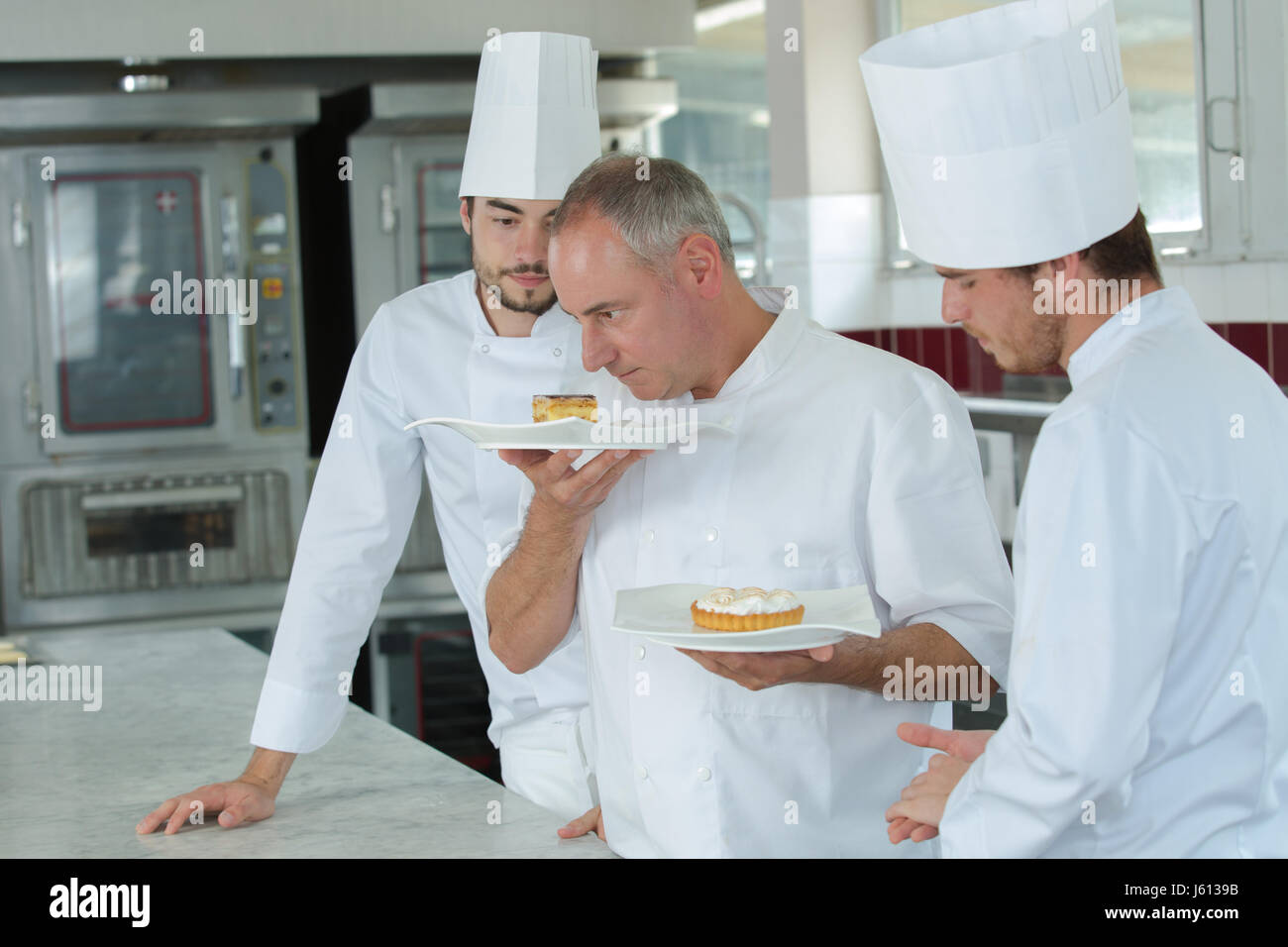 Male chef smelling tasty hi-res stock photography and images - Alamy
