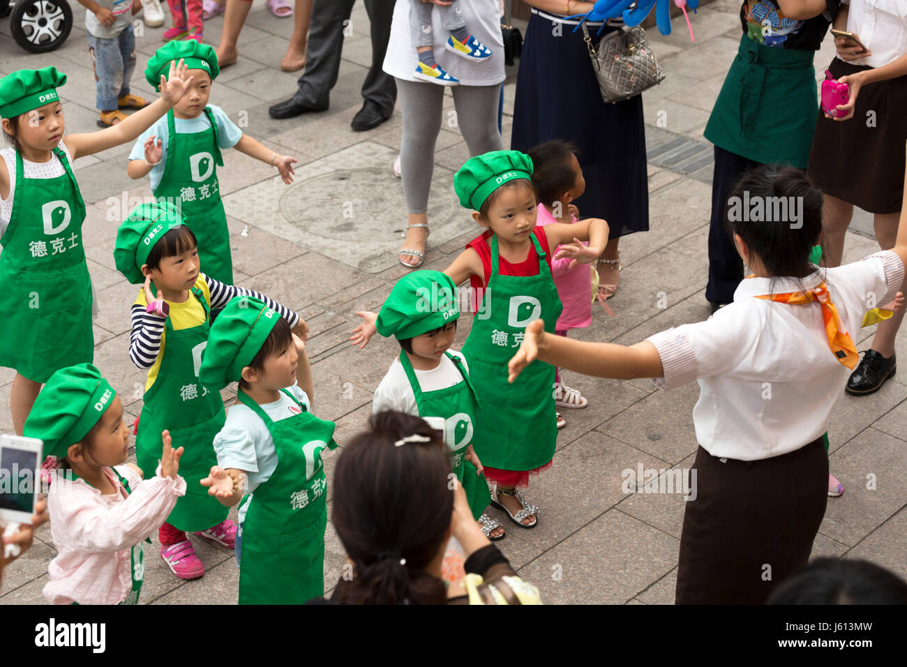 Chinese children learning to dance at fast food restaurant, Yinchuan, Ningxia, China Stock Photo