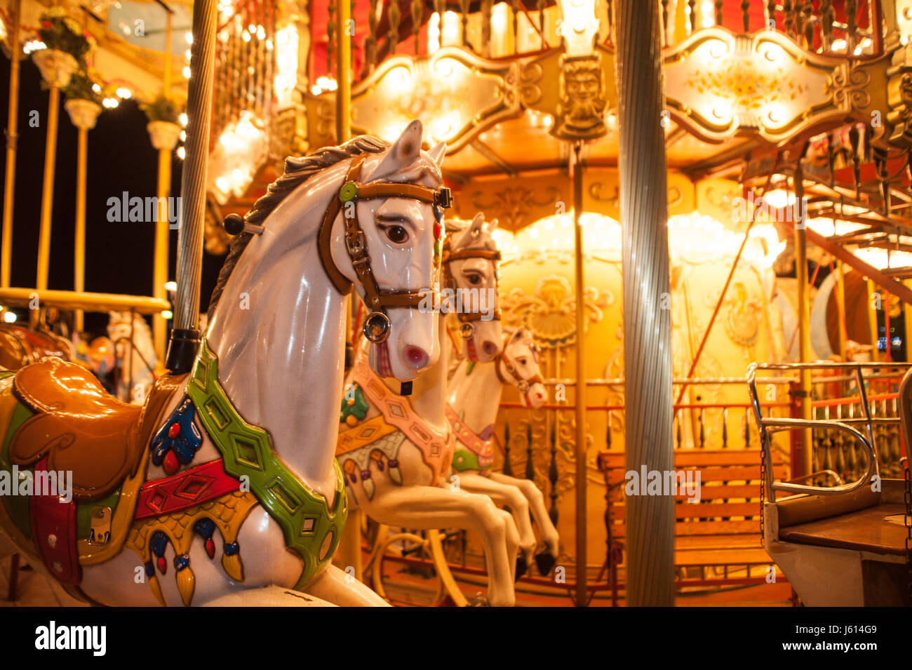 Old carousel with wooden horse in Paris, France Stock Photo