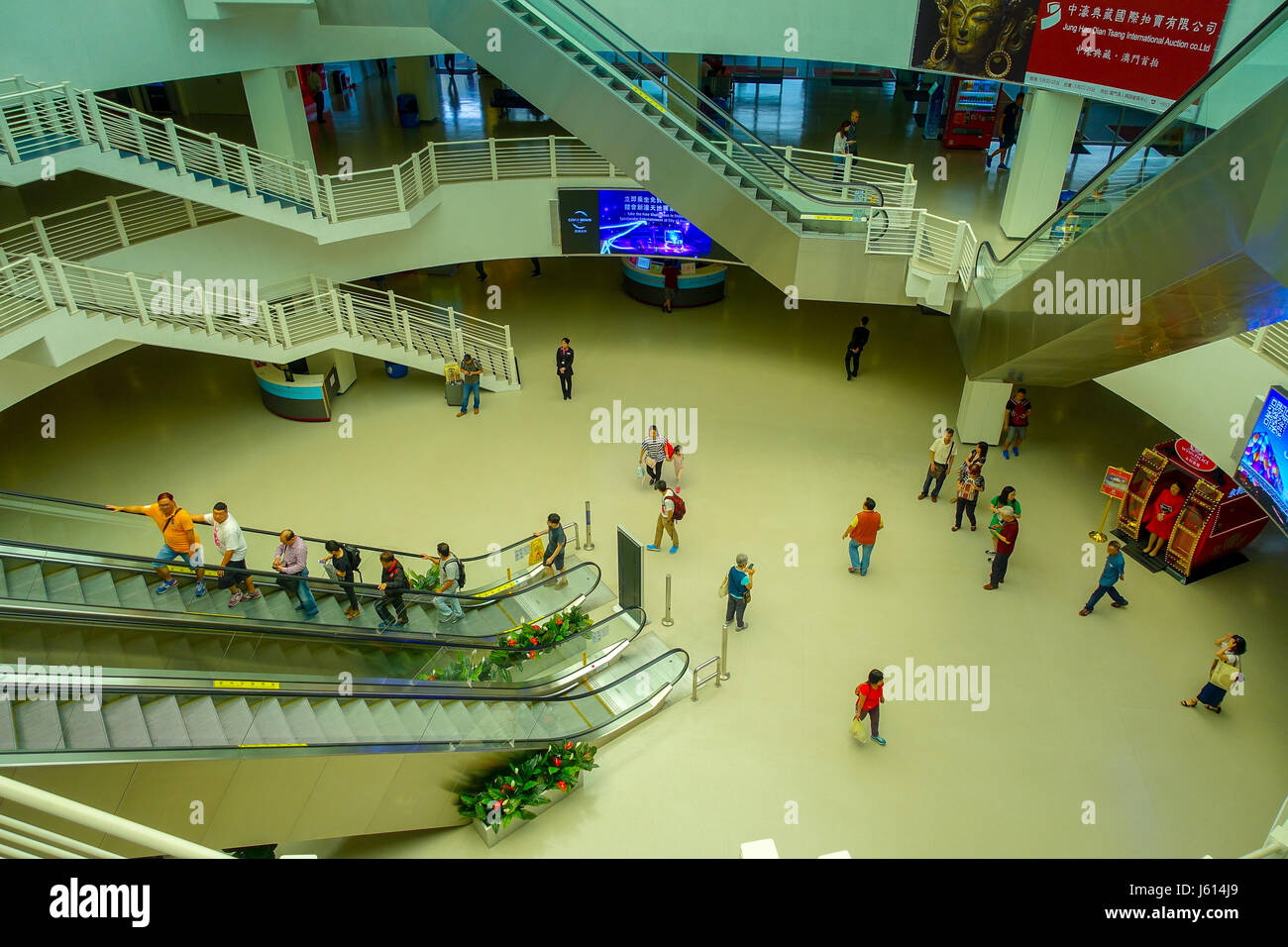 MACAU, CHINA- MAY 11, 2017: An unidentified people walking inside of the Macau Ferry terminal Stock Photo