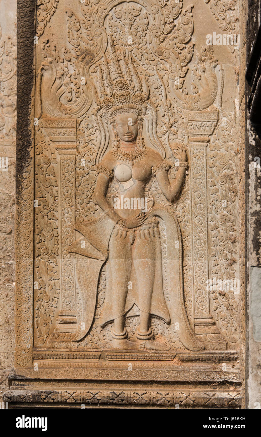 Bass relief in stone of a single apsara, heavenly nymph, at Angkor Wat Stock Photo