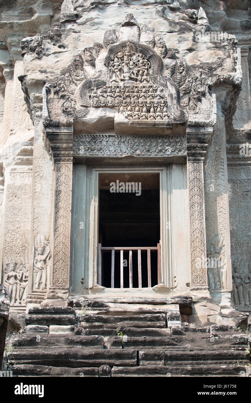 Doorway to spire at the top of Angkor Wat carved with figures of celestial beings Stock Photo